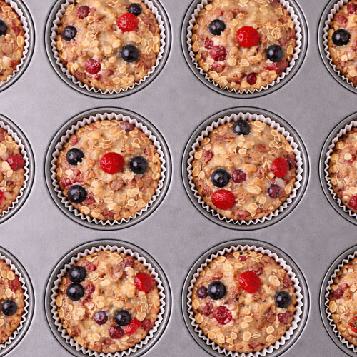 Berry oatmeal muffins in baking tray