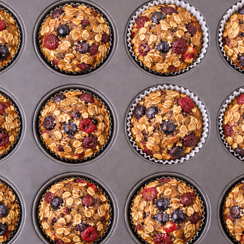 Berry oatmeal muffins in baking tray, ready to serve